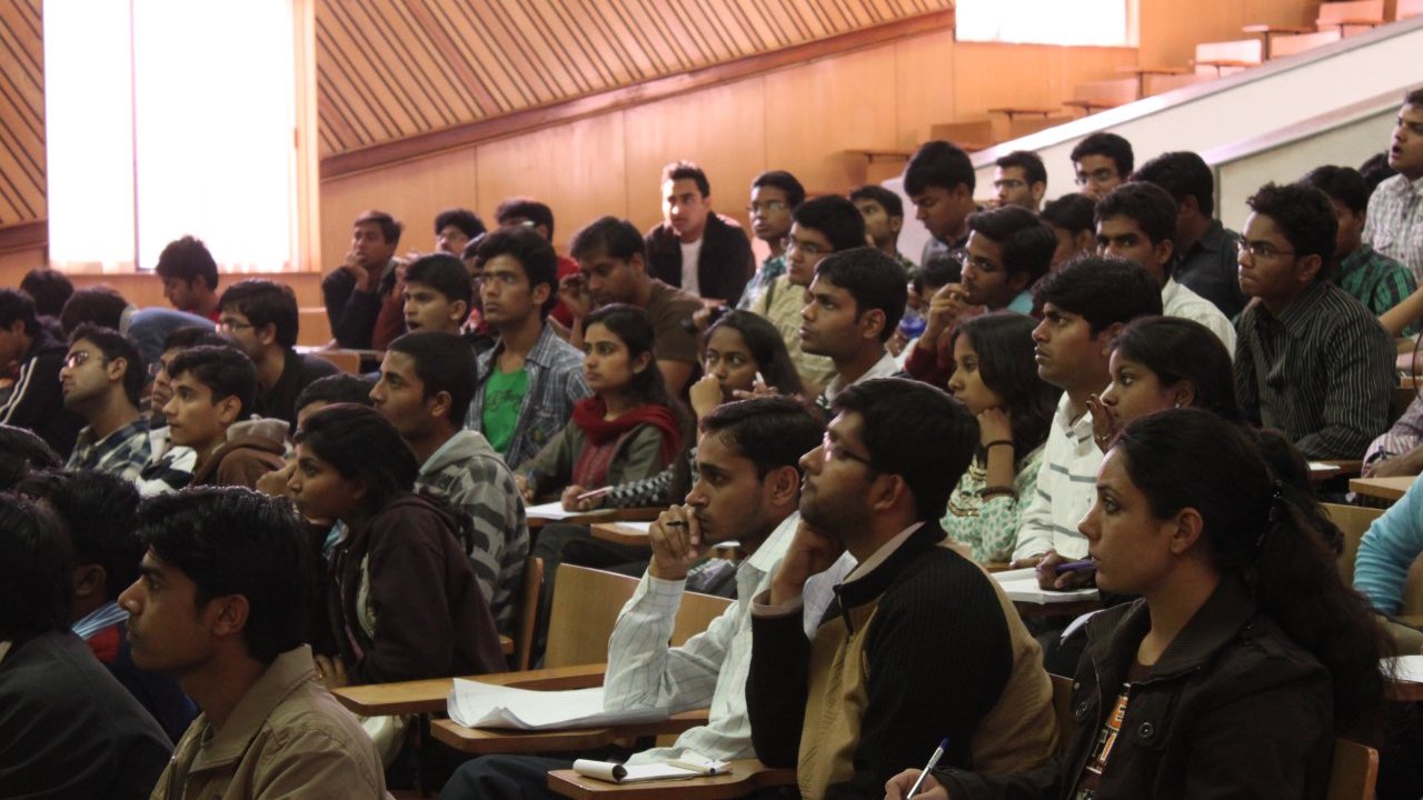 Participants and students attending a workshop and conference seminar in India
